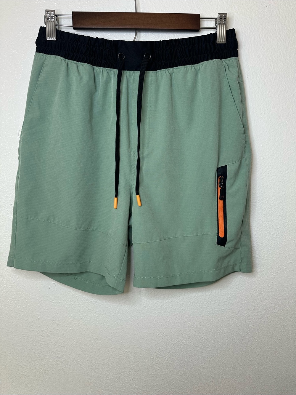 Avalanche Men's Sage Green Athletic Shorts with Black Waistband and Orange Zip